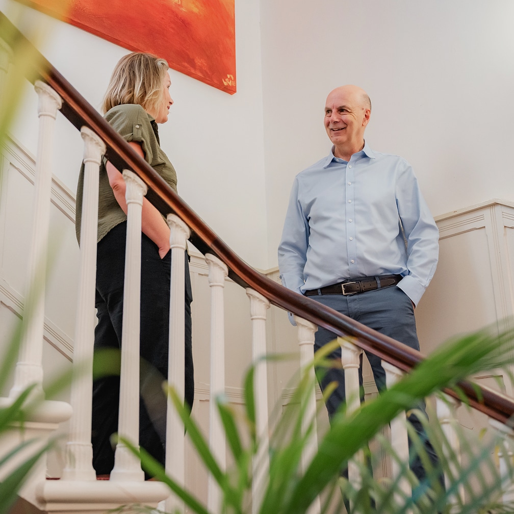 Rezera employees on stairs