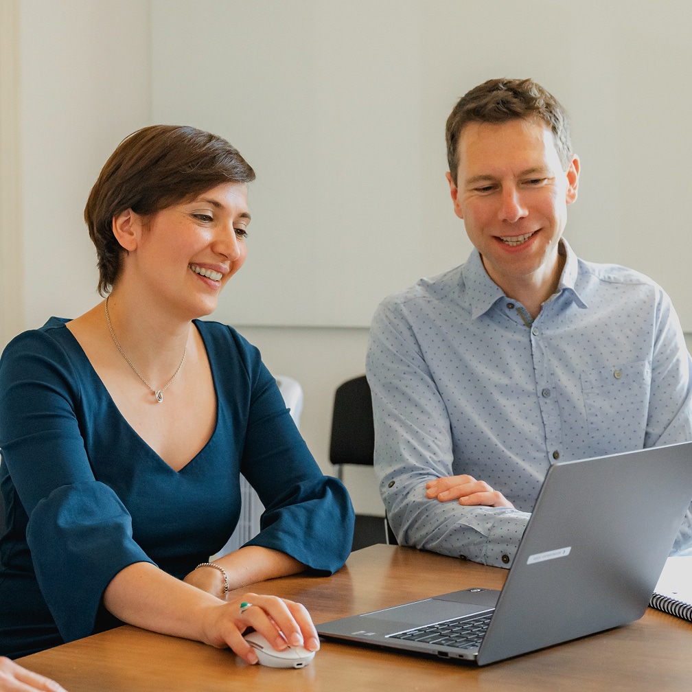 Rezera employees using laptop